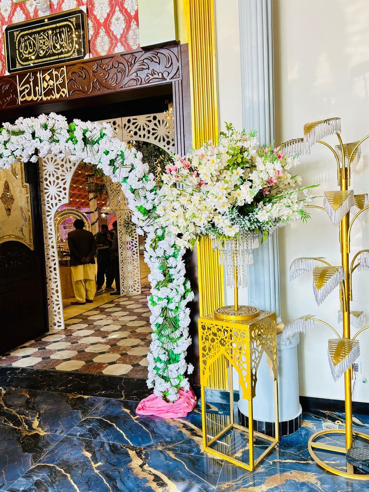 Floral entrance arch for arriving guests